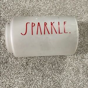 White Canister with Red 'Sparkle' Text
